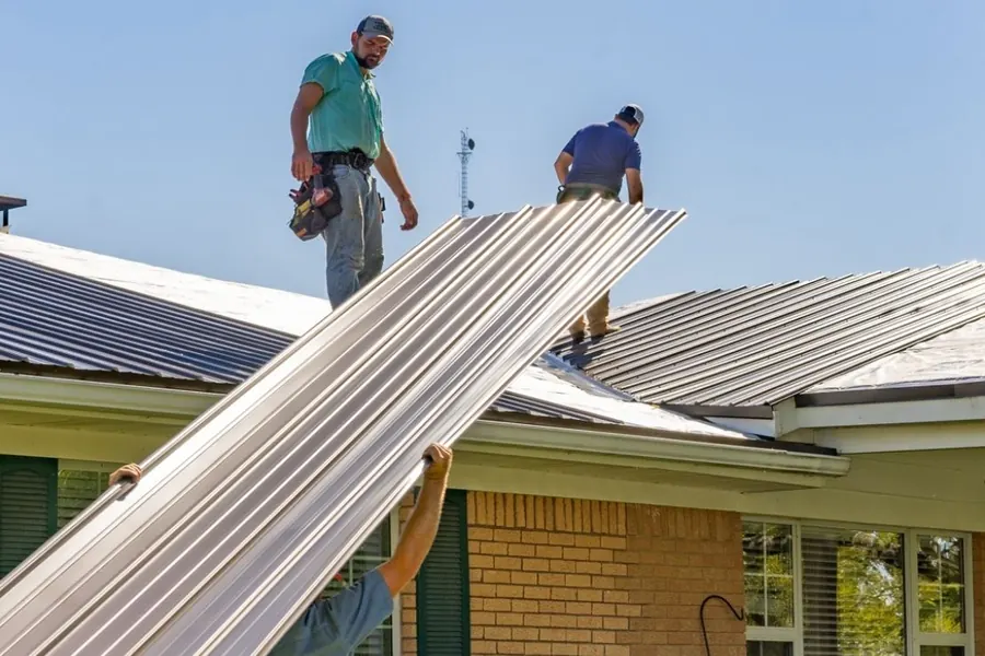 Texas Metal Master crew installing metal roof panels