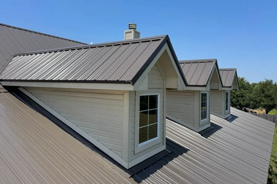 Close-up of dormer windows with precision metal roof trim