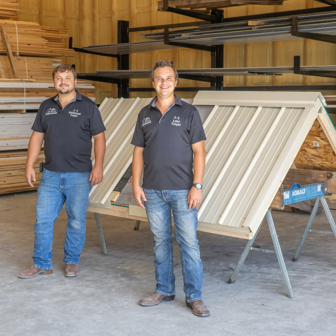 Nathanael and Luke Troyer, owners of Texas Metal Master, standing in their shop